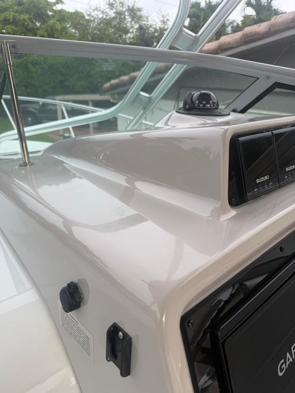 Console and gunwale gelcoat restored to a deep even gloss