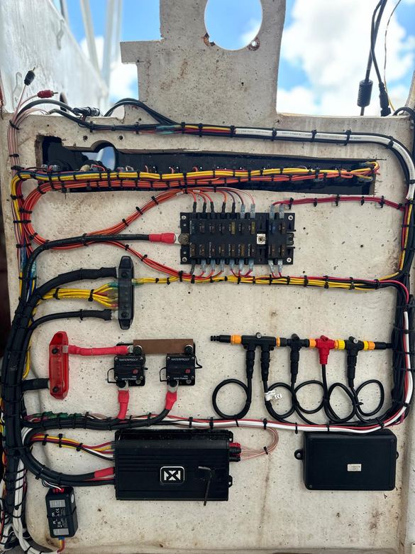 Console rewire with a labeled fuse block, ignition-protected breakers and an NMEA 2000 backbone